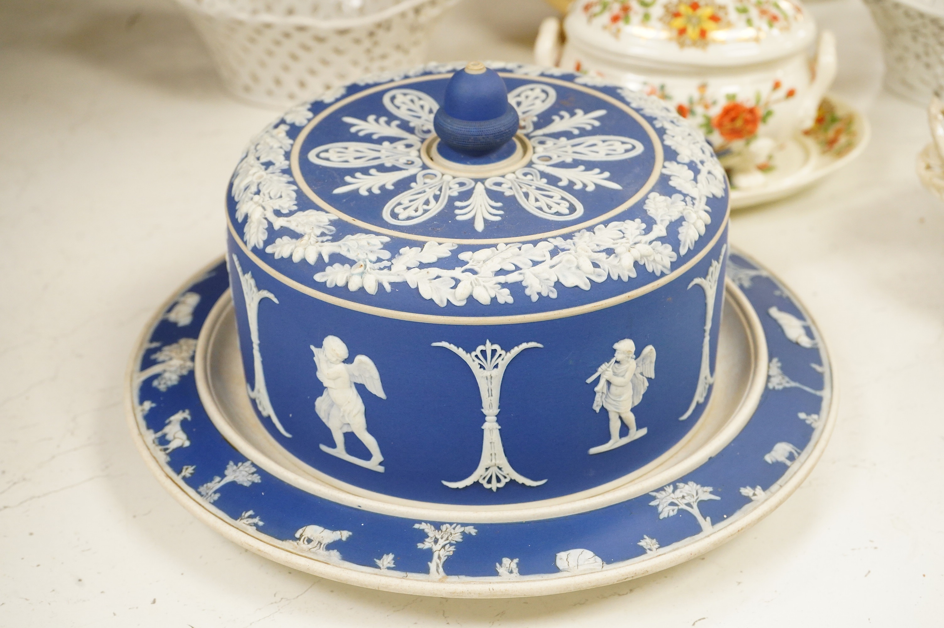 A 19th century Derby tureen and cover, a pair of Royal Worcester blush vase-26cm high, a Belleek basket and cover, a Wedgwood blue Jasperware cheese dish and associated cover, two continental baskets and vase. (7).
